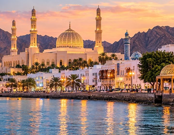 Muscat mosque and corniche at sunset